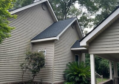 A shot of a connecting awning roof from a home to a car awning.